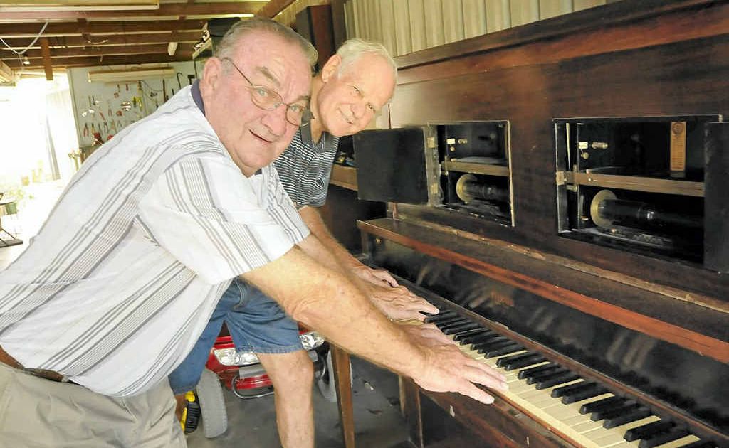 TINKLING THE IVORIES: Casino Historical Society president Bob Moran and vice-president Barry Dennis try to get a tune out of the old pianola the pair rescued from the Gold Coast. The vintage instrument was once used at Casino’s old Rink Theatre. TINKLING THE IVORIES: Casino Historical Society president Bob Moran and vice-president Barry Dennis try to get a tune out of the old pianola the pair rescued from the Gold Coast. The vintage instrument was once used at Casino’s old Rink Theatre.